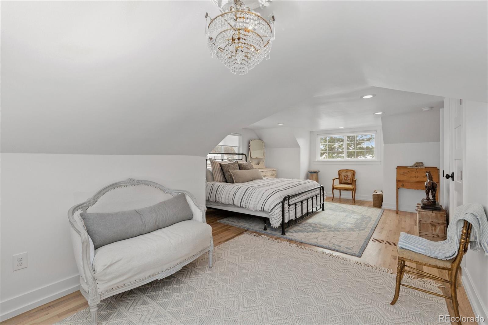 2073 South Perry Park Road Sedalia, CO 80135 - Photo 21 of 40 a bedroom with a bed and a couch