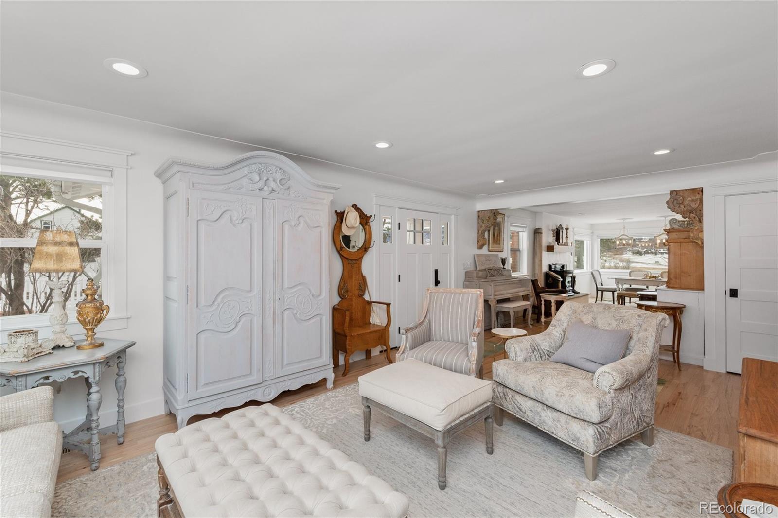 2073 South Perry Park Road Sedalia, CO 80135 - Photo 25 of 40 a living room with furniture and a wooden floor