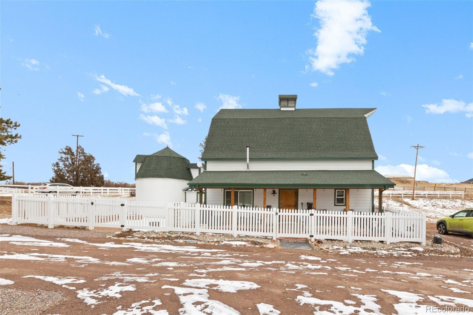 2073 South Perry Park Road Sedalia, CO 80135 - Photo 34 of 40 a front view of a house with a yard