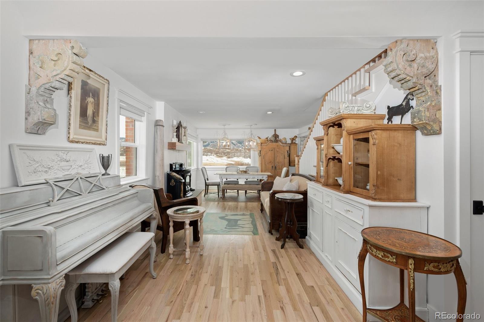 2073 South Perry Park Road Sedalia, CO 80135 - Photo 6 of 40 a living room with furniture and a wooden floor