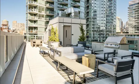 a view of a building with outdoor seating