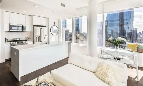 a living room with granite countertop furniture and a fireplace