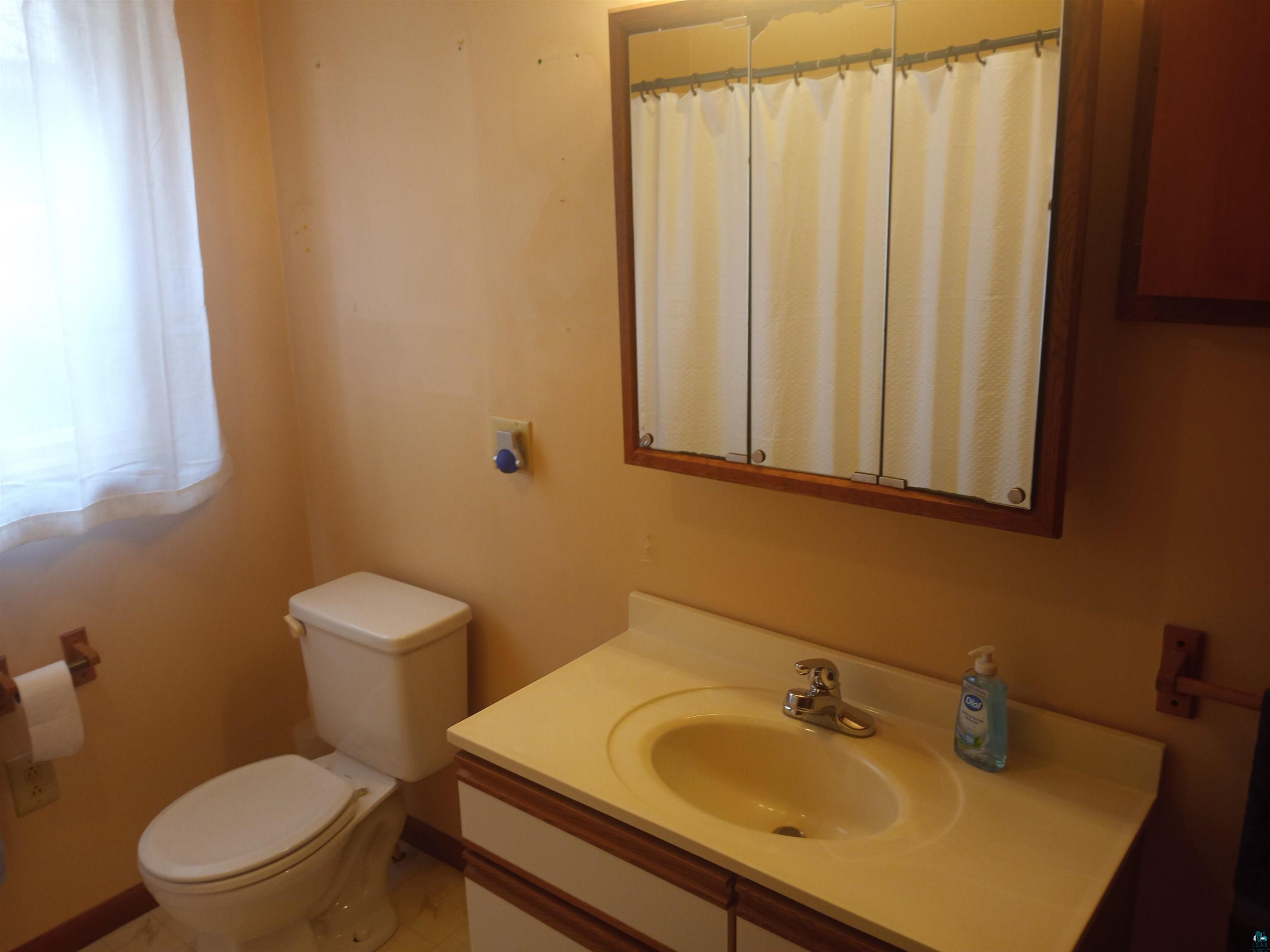 22715 Elm Street Cornucopia, WI 54827 - Photo 14 of 23 Bathroom with Tub & Shower