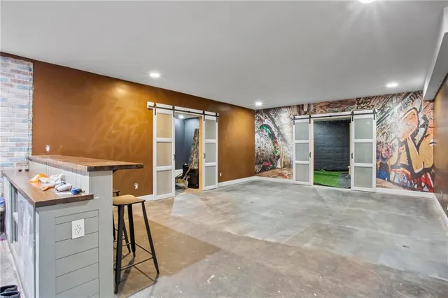 a view of an entryway with wooden floor