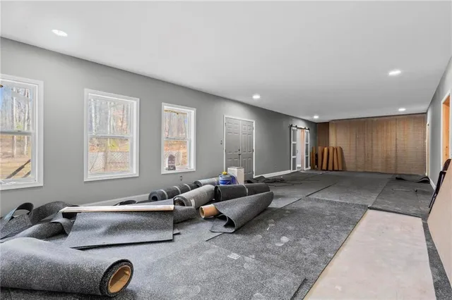a living room with furniture and windows