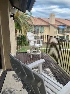 a view of balcony with furniture