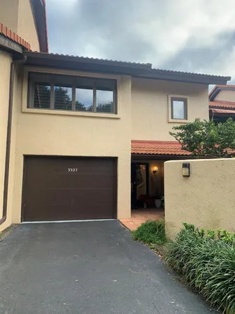 a front view of a house with a garage
