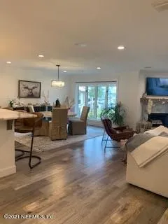 a living room with furniture and a piano