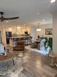 a living room with lots of furniture and a table