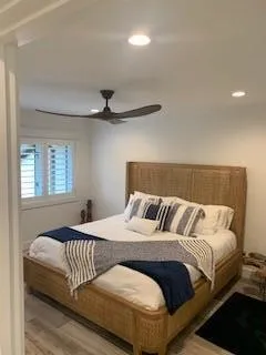 a bedroom with a bed and window