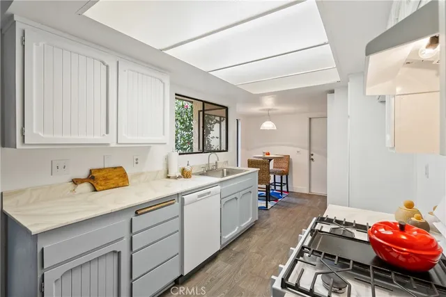 a kitchen with a sink and cabinets
