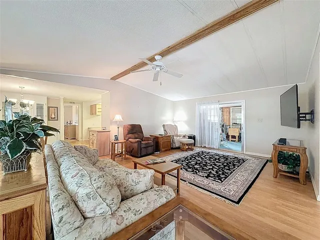 a dining room with furniture and chandelier