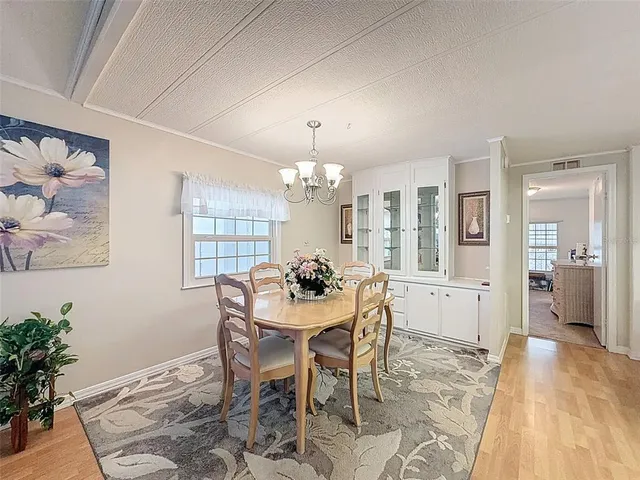 a dining room with furniture and window