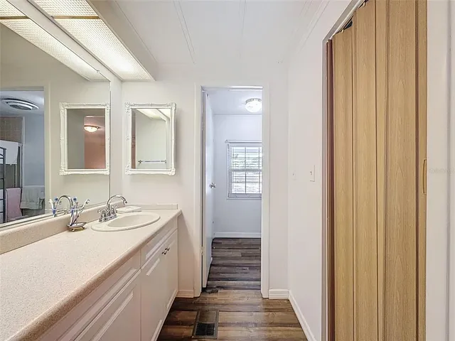 a living room with furniture tv and a large window