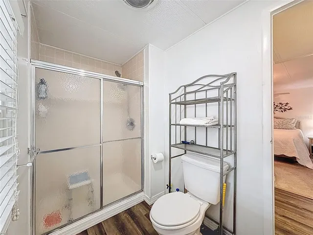 a view of a hallway with windows