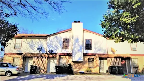 a front view of a building with street view