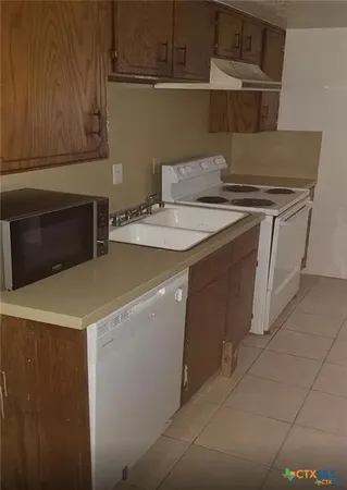 a utility room with washer and dryer