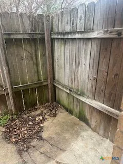 a view of outdoor space with wooden fence