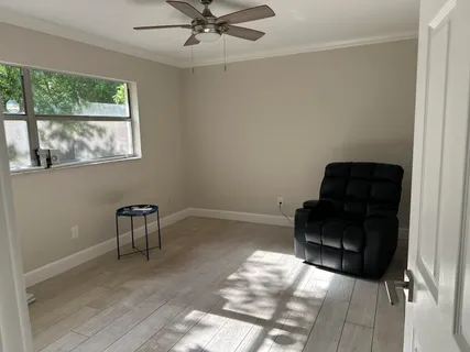 a living room with furniture and a window
