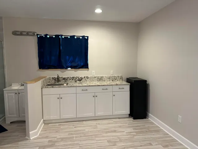 a view of a sink and a cabinets