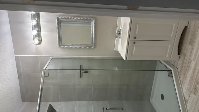 a bathroom with a shower and toilet