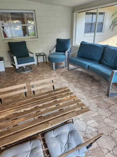 a living room with furniture and a table