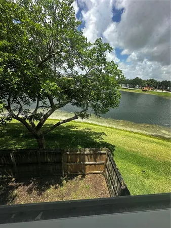 a view of a lake with a yard