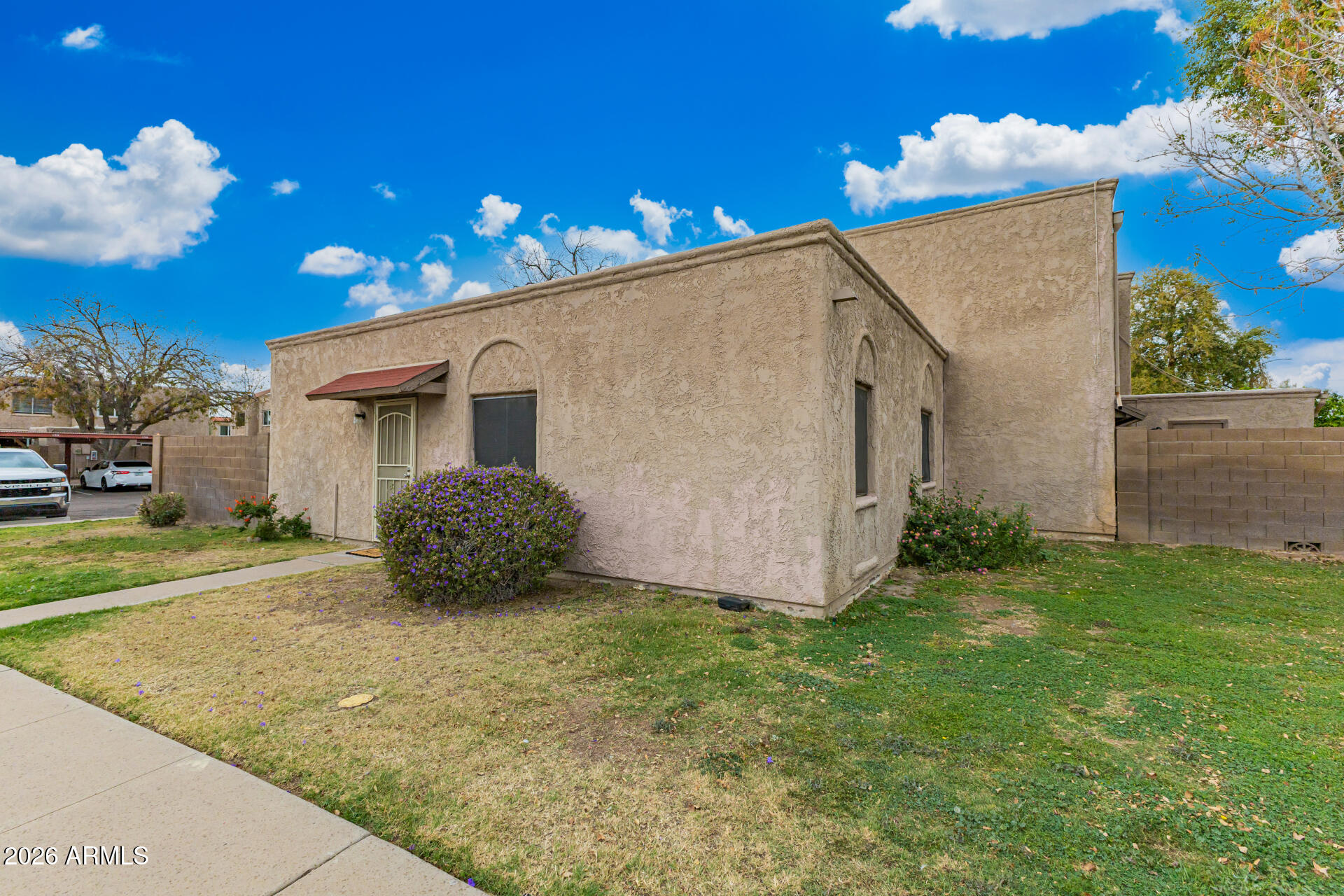 600 South Dobson Road, Unit 122 Mesa, AZ 85202 - Photo 14 of 28 a view of a house with a yard