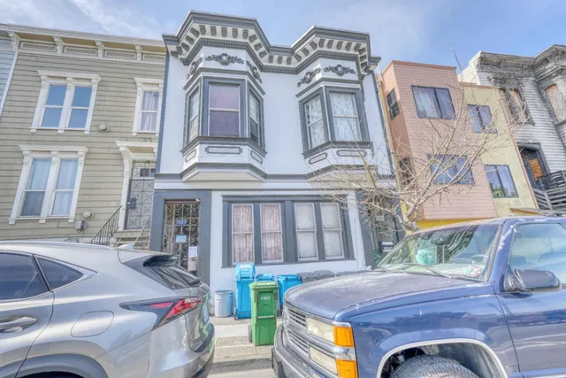 a view of a brick building with many windows