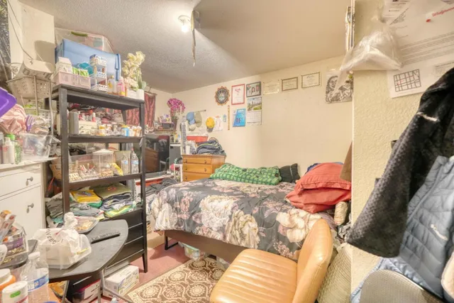 a view of staircase with wooden floor and white walls