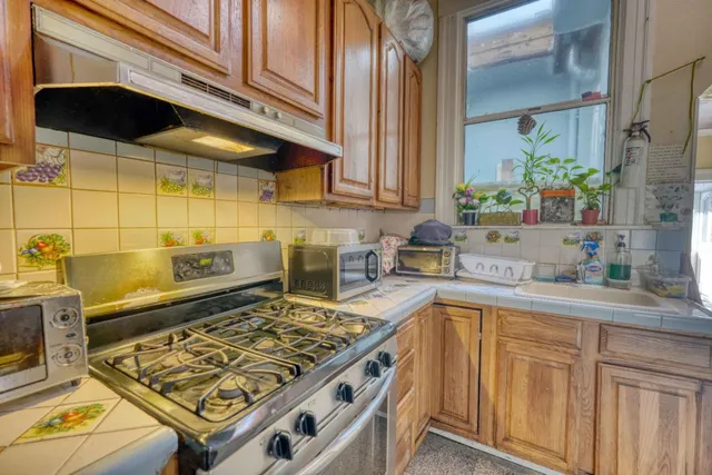 a bathroom with a sink mirror vanity and toilet