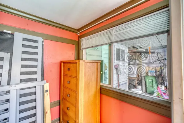 a bedroom with bed and a couch