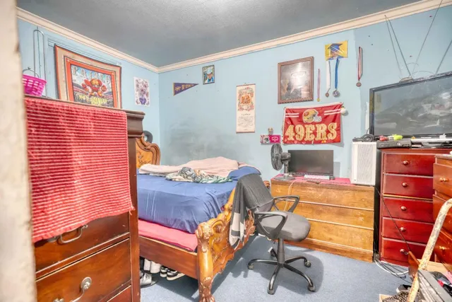 a storage room with furniture and stairs