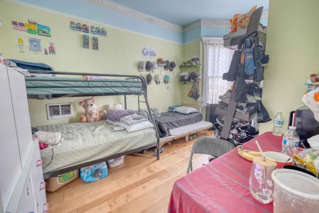 a kitchen with stainless steel appliances granite countertop a stove a refrigerator and a dining table view