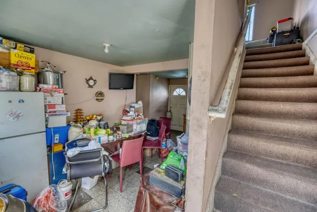 a view of living room filled with furniture and gym equipment
