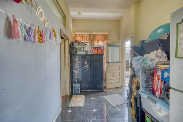 a view of a bedroom with bed and workspace