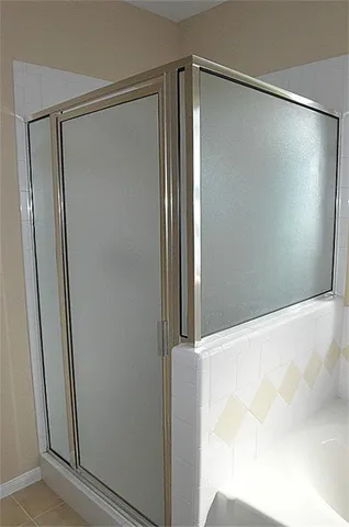 a bathroom with 2 sink and a mirror