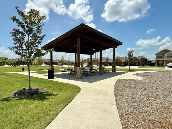 a view of a swimming pool with a patio