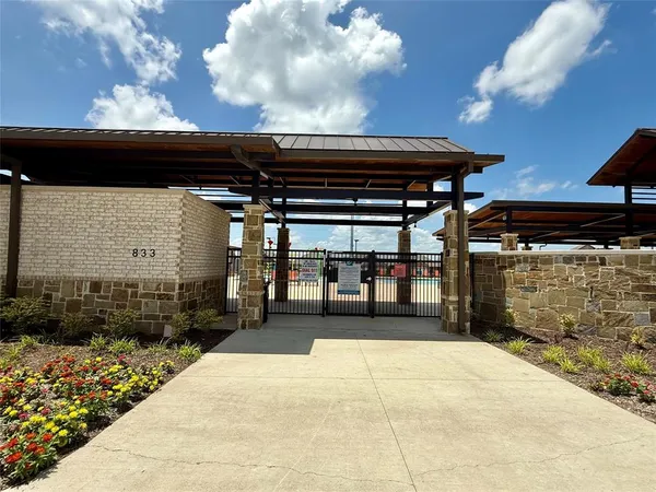 a view of entryway with a lot of flower pots
