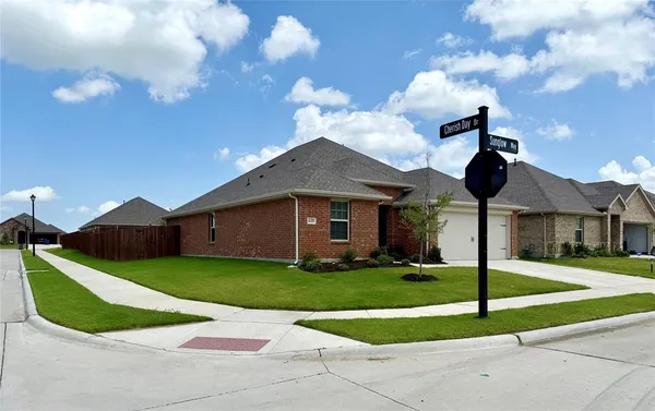 a very nice looking house with a yard