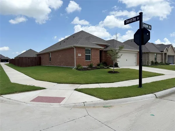a front view of a house with yard