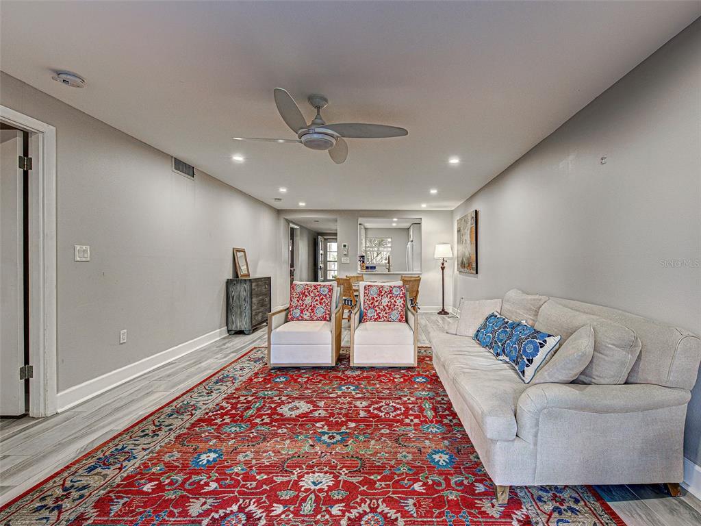 260 Santa Maria Street, Unit 109 Venice, FL 34285 - Photo 11 of 64 a living room with furniture and a rug