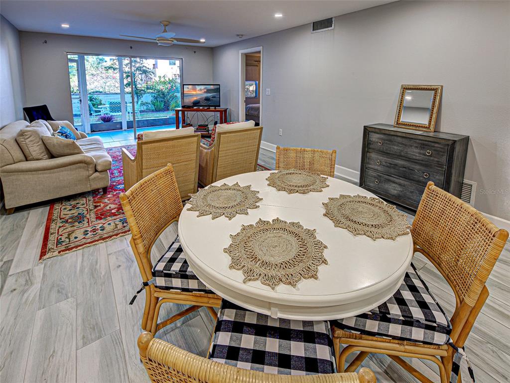 260 Santa Maria Street, Unit 109 Venice, FL 34285 - Photo 15 of 64 a living room with furniture and a large window
