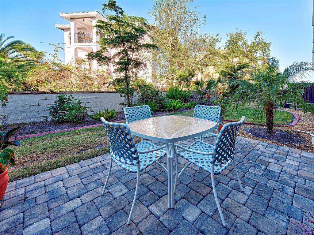 260 Santa Maria Street, Unit 109 Venice, FL 34285 - Photo 24 of 64 a view of a backyard with sitting area