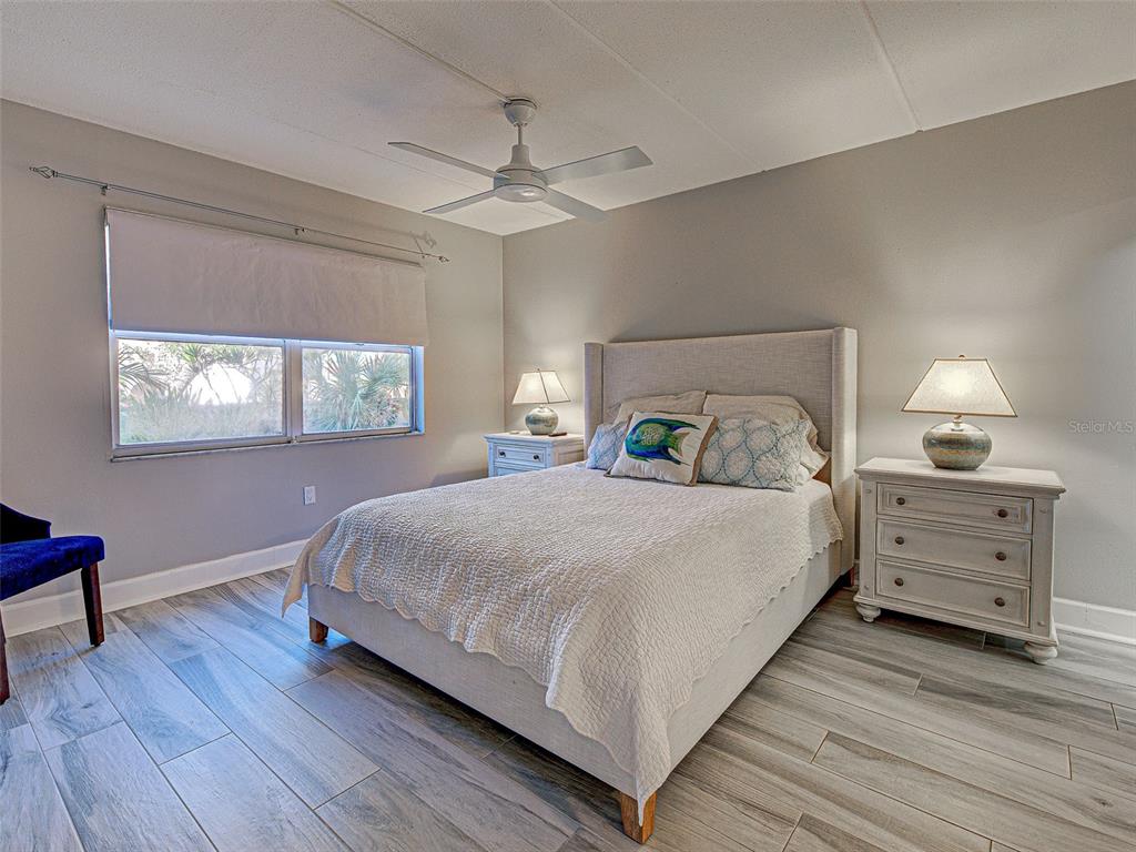 260 Santa Maria Street, Unit 109 Venice, FL 34285 - Photo 27 of 64 a bedroom with a bed and a window