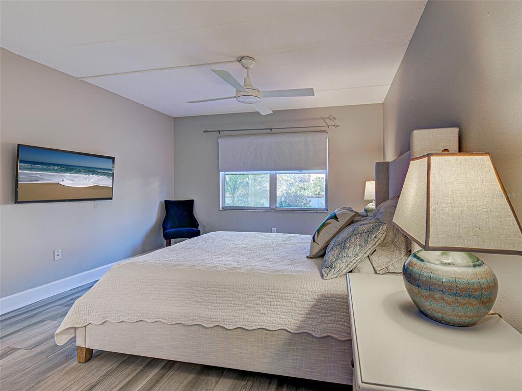 260 Santa Maria Street, Unit 109 Venice, FL 34285 - Photo 28 of 64 a bedroom with a bed and window