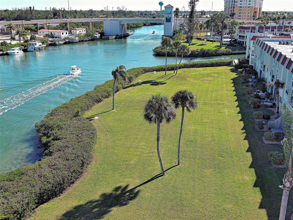 260 Santa Maria Street, Unit 109 Venice, FL 34285 - Photo 3 of 64 a view of a lake with a house