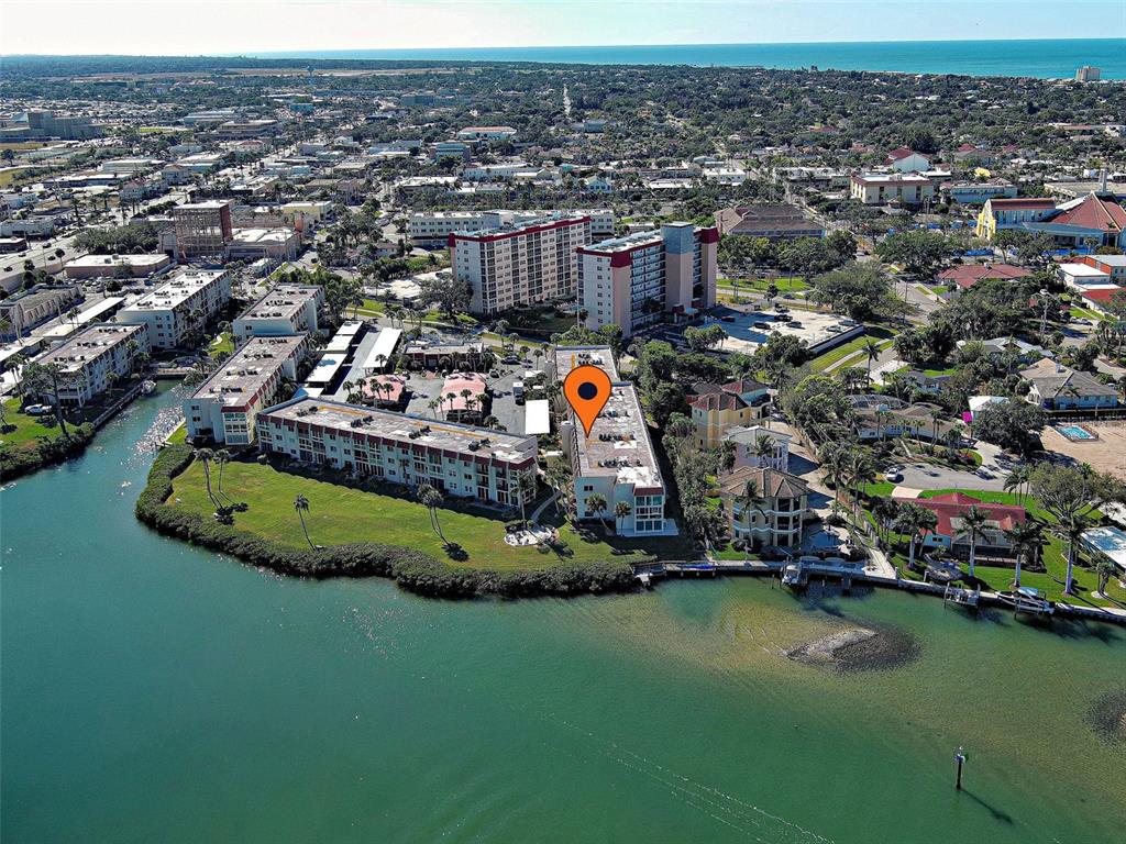 260 Santa Maria Street, Unit 109 Venice, FL 34285 - Photo 34 of 64 an aerial view of a house with a garden and lake view