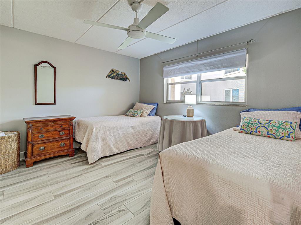 260 Santa Maria Street, Unit 109 Venice, FL 34285 - Photo 35 of 64 a bedroom with double bed and a dresser