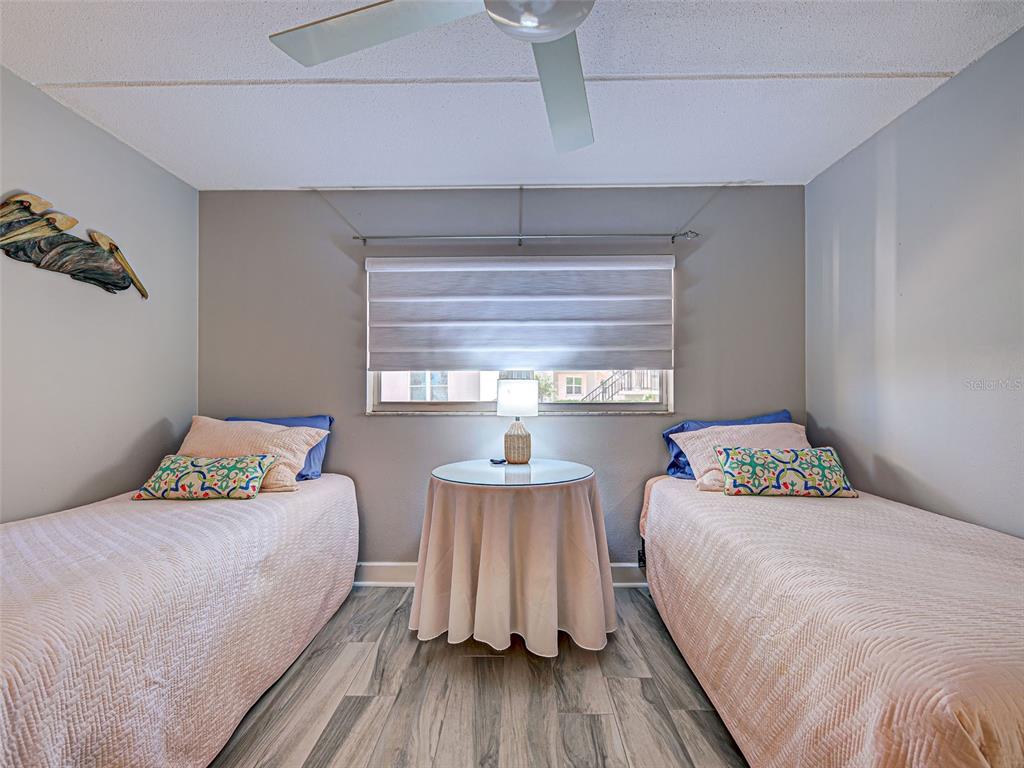 260 Santa Maria Street, Unit 109 Venice, FL 34285 - Photo 38 of 64 a bedroom with a bed and window